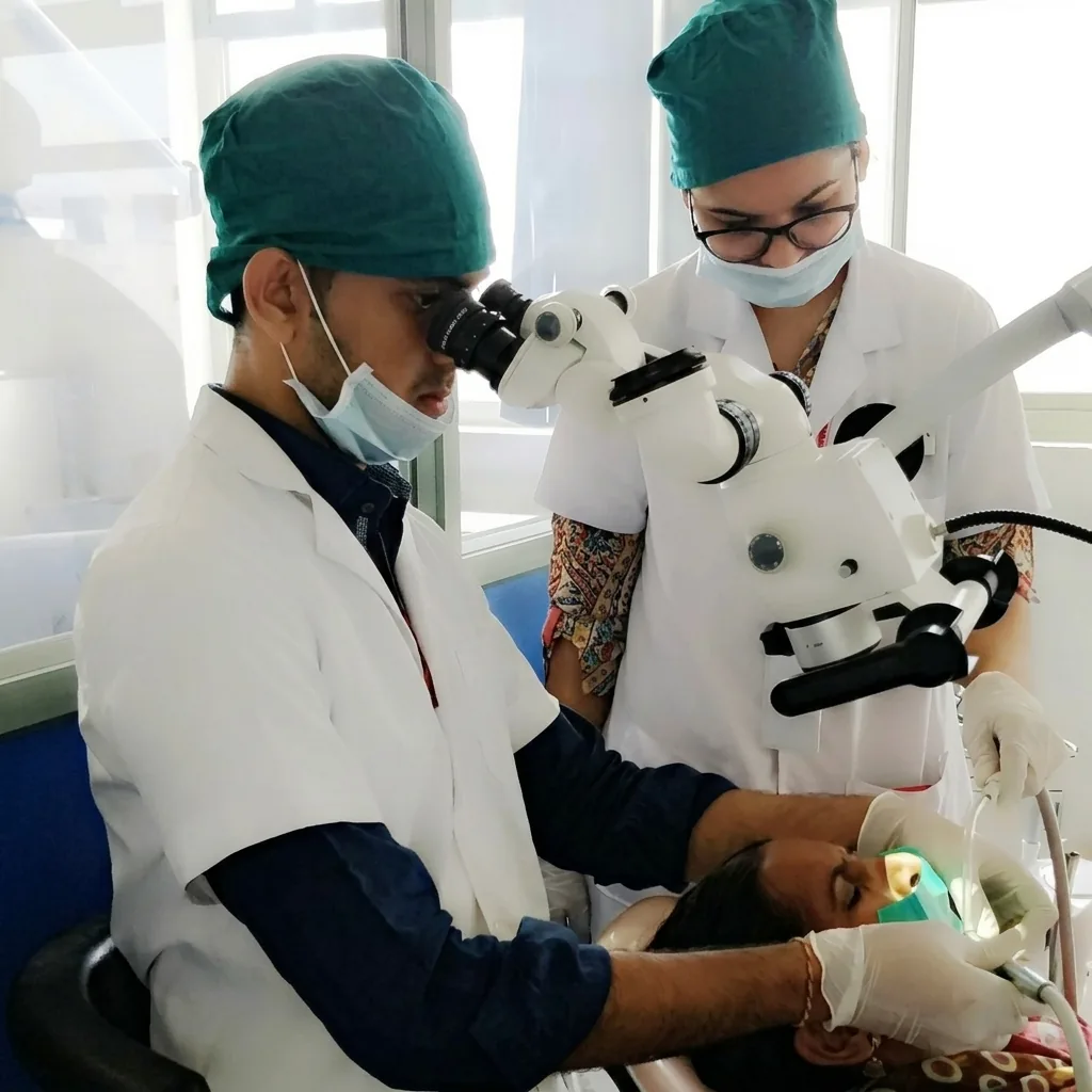 Dr. Chinmay performing microscope-guided endodontic treatment